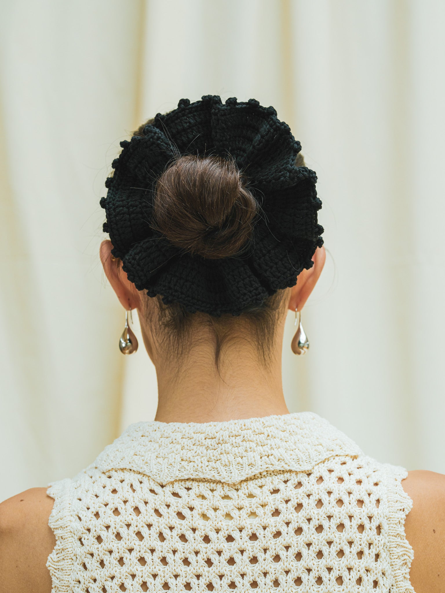 Back view of hand crocheted scrunchie in black.